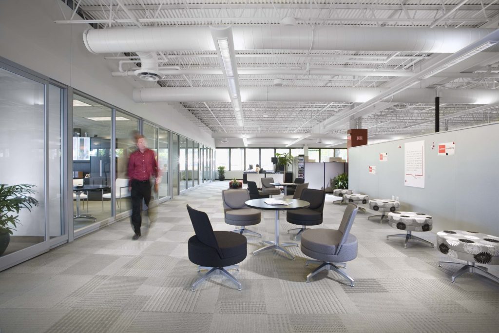 Man walking through modern office space