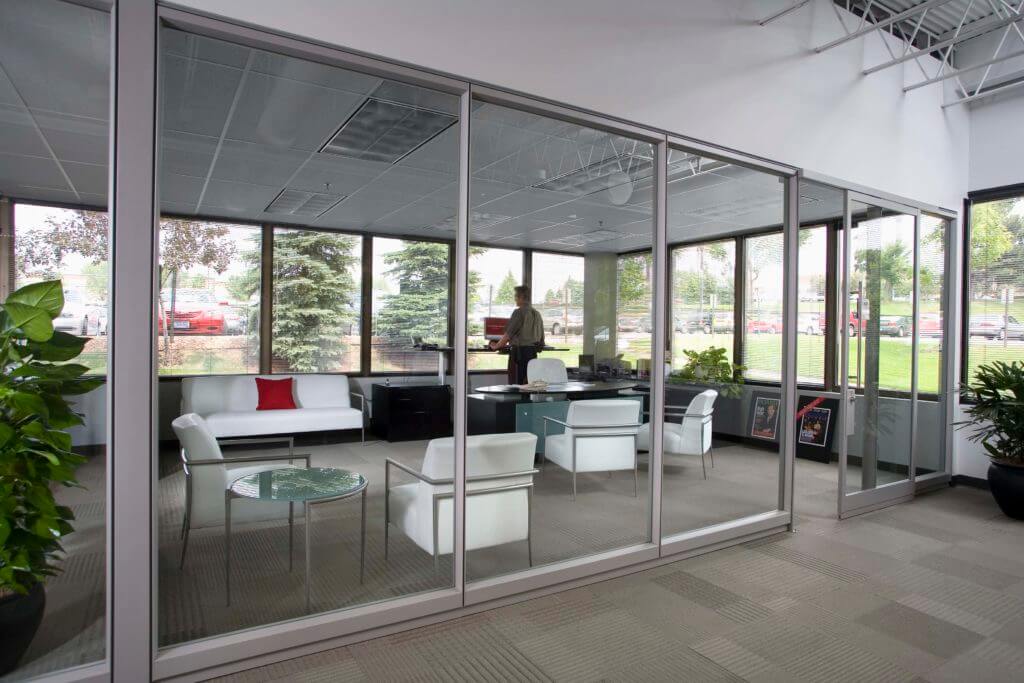 Man standing at desk in modern office